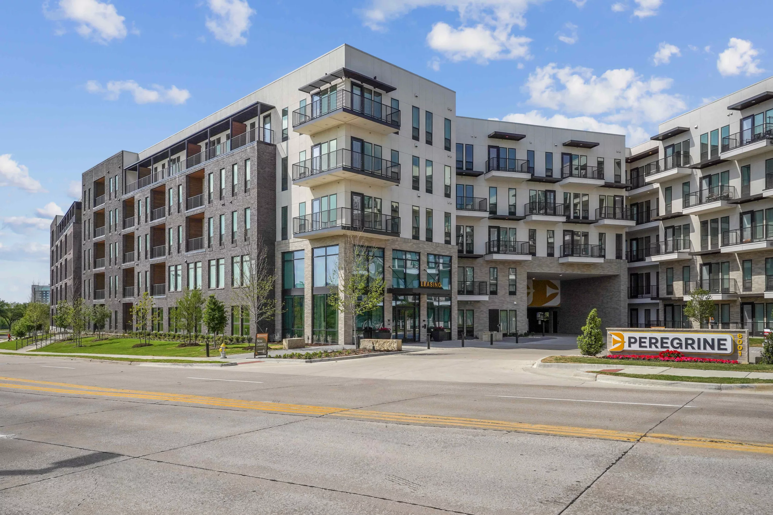 Modern apartment exterior with balconies and Peregrine signage.